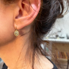 Textured, lacy, lemon-shaped earring, shown in 14k yellow with diamonds , shown on ear for scale