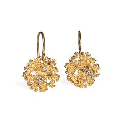 Textured round earring on a wire; has negative space and lacy edges; white and grey diamond mix