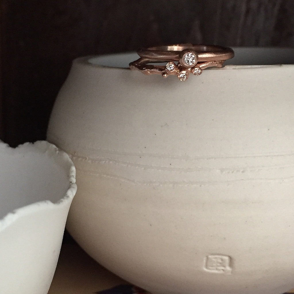 Small, single branch ring with 3 diamond buds; shown inrose gold and shown with small pod ring with larger center diamond