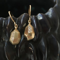 Faceted pear-like drop earring on wire with pavé diamonds in one facet per earring; shown in yellow gold
